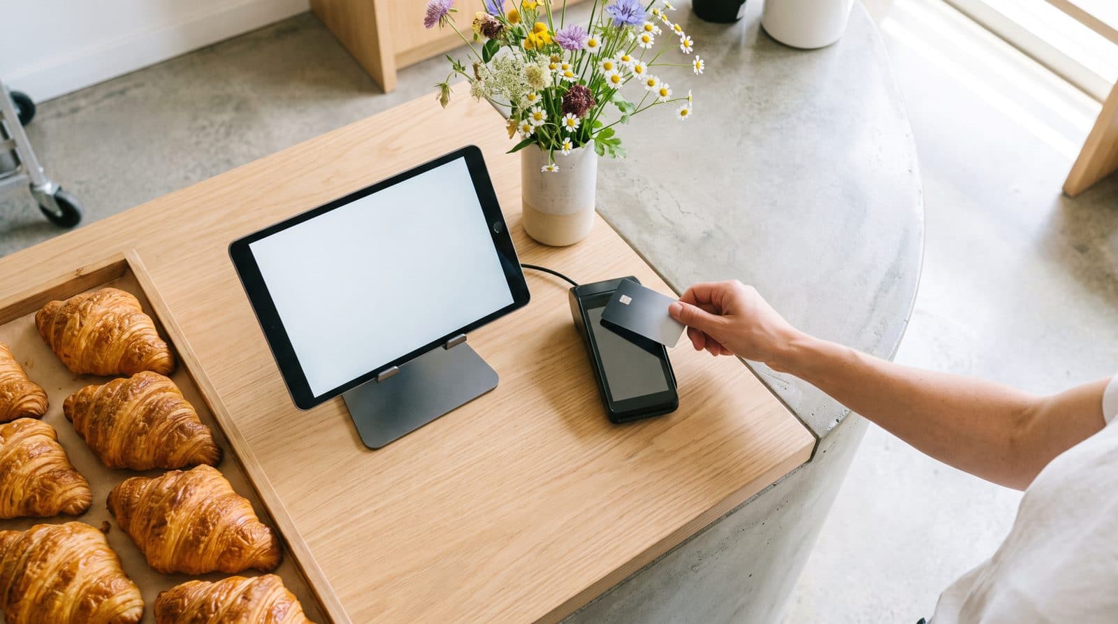 A bakery counter with a tablet point of sale